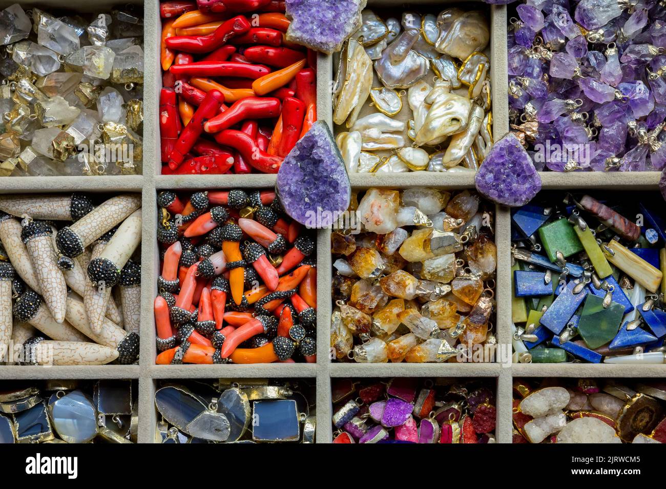 ISTANBUL TURKEY, January 2022. Different souvenirs made of semi-precious orornamental stones at the Grand Bazaar such as neck pendants and bracelet ch Stock Photo