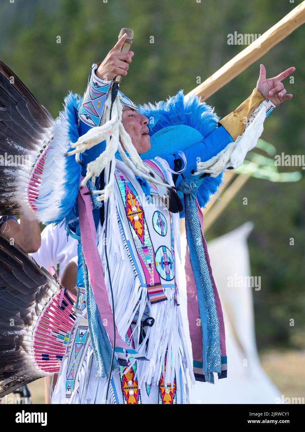 Madison Junction, United States of America. 23 August, 2022. Apsaalooke tribe rapper and thunder dancer Superman performs at the All Nations Teepee Village to mark the 150th anniversary of Yellowstone National Park August 23, 2022 in Madison Junction, Montana. The project by Mountain Time Arts features 13 teepee lodges and performances by Native American artists that signify a new era of Indigenous inclusion and representation in Yellowstone National Park. Credit: Ashton Hooker/NPS/Alamy Live News Stock Photo
