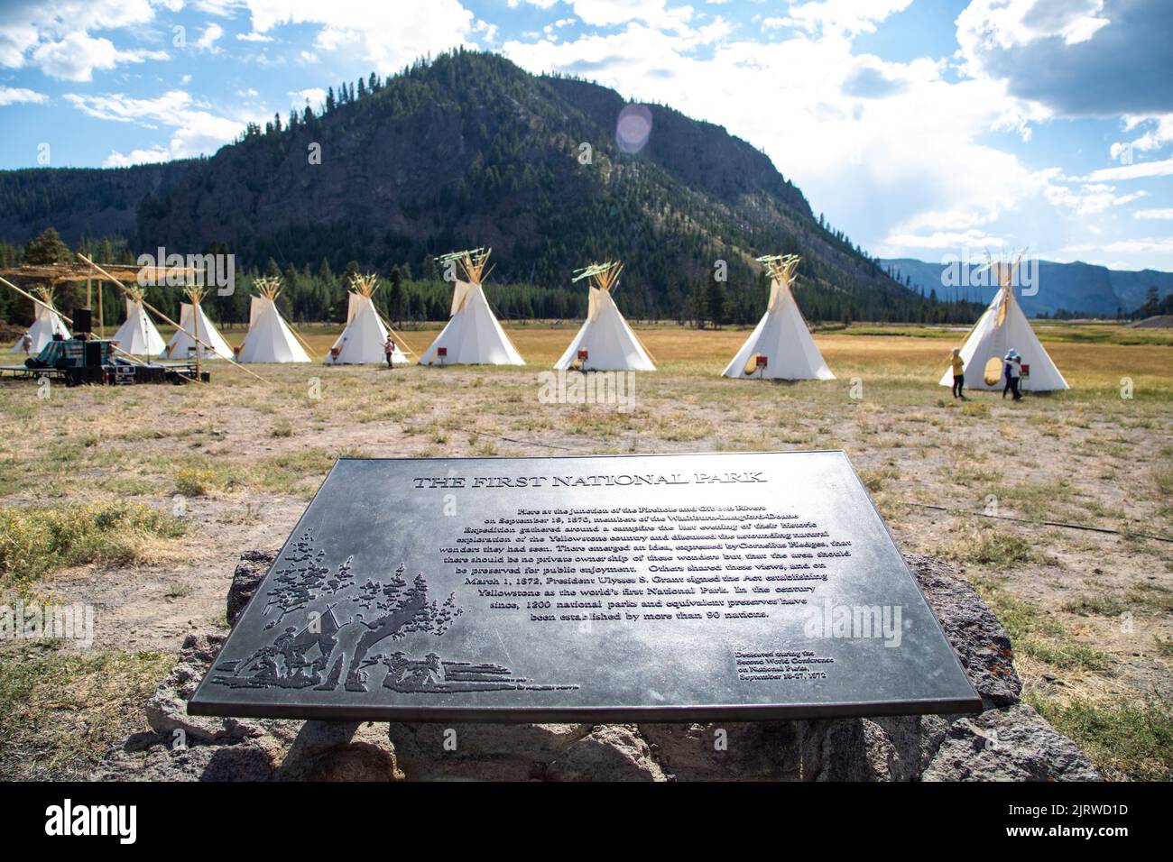 Madison Junction, United States of America. 23 August, 2022. Native American teepee lodges at the All Nations Teepee Village to mark the 150th anniversary of Yellowstone National Park August 23, 2022 in Madison Junction, Montana. The project by Mountain Time Arts features 13 teepee lodges that signify a new era of Indigenous inclusion and representation in Yellowstone National Park. Credit: Ashton Hooker/NPS/Alamy Live News Stock Photo
