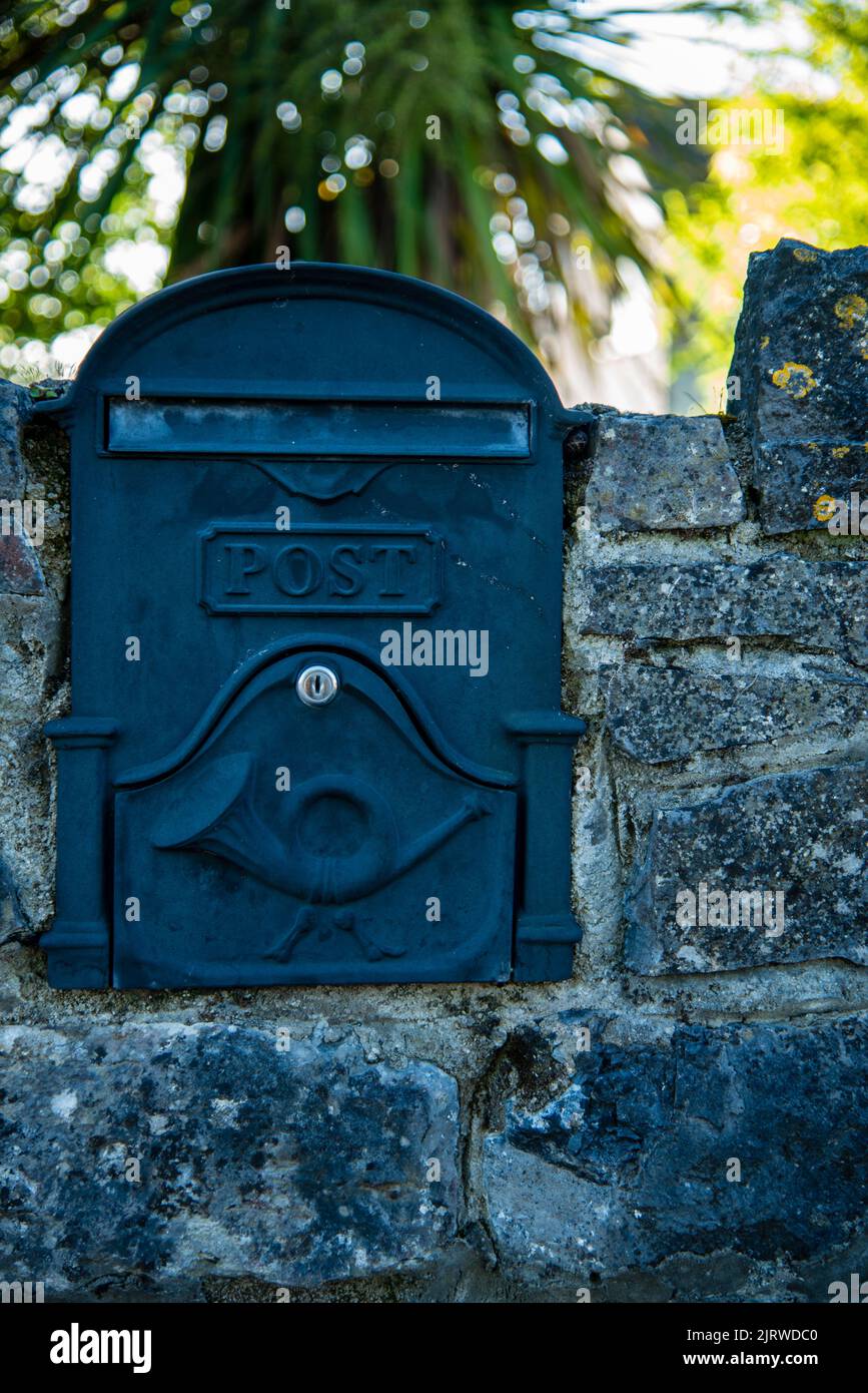 Mailboxes post mounted at entry gates, mailboxes embedded in a stone