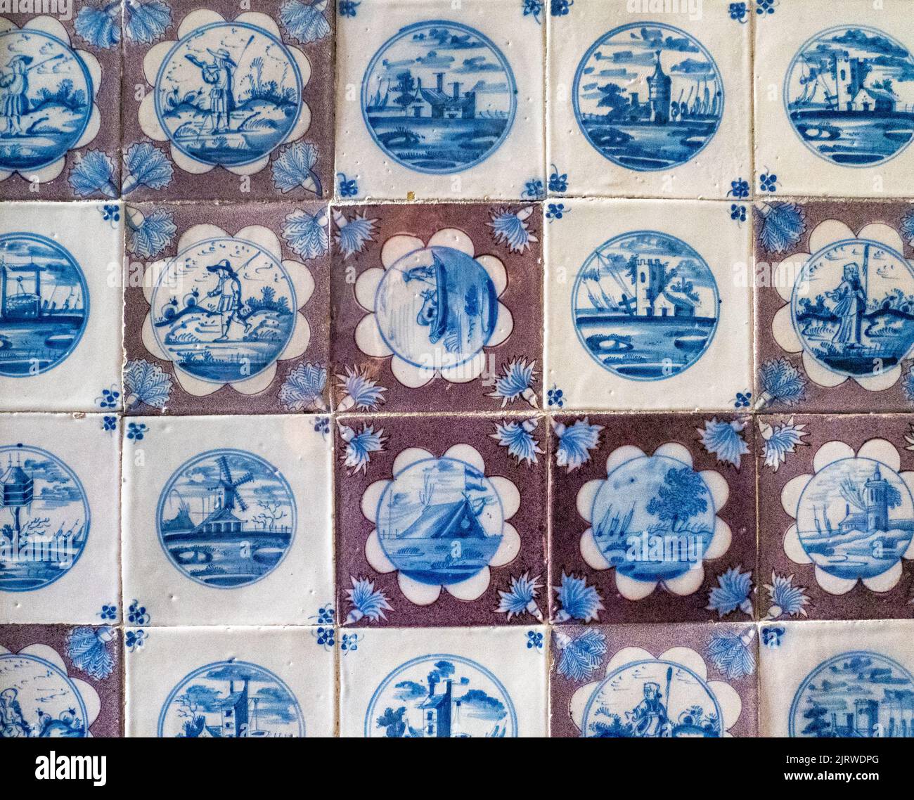 Individually hand painted wall tiles in the King's toilet at the Rosenborg Slot Copenhagen Denmark with a single tile placed wrongly Stock Photo