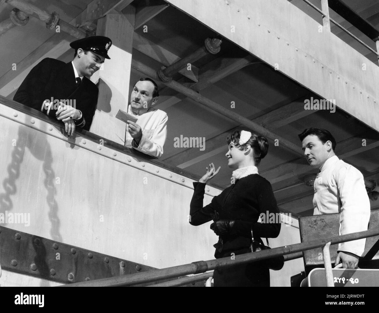 DIRK BOGARDE BRIGITTE BARDOT and MAURICE DENHAM in DOCTOR AT SEA 1955 director RALPH THOMAS novel / adaptation Richard Gordon screenplay Nicholas Phipps and Jack Davies costume design Jane Ellacott producer Betty E. Box Group Film Productions / J. Arthur Rank Film Distributors Stock Photo