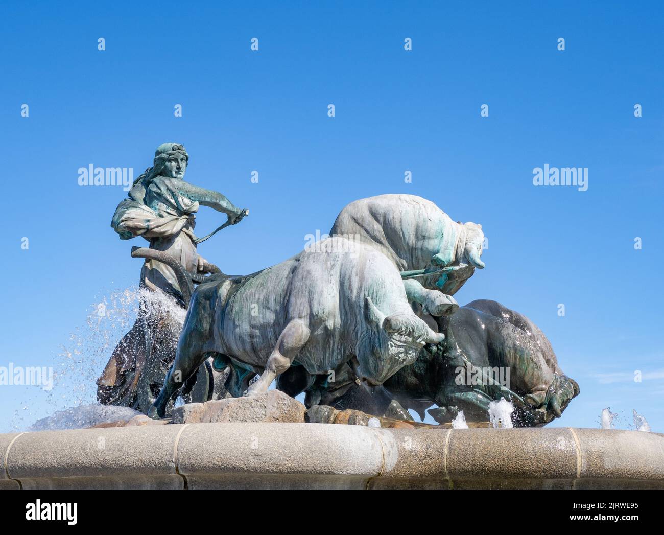 Bronze sculpture of the goddess Gefion ploughing with straining bulls to form land for the island of Zealand on which Copenhagen Denmark is founded Stock Photo