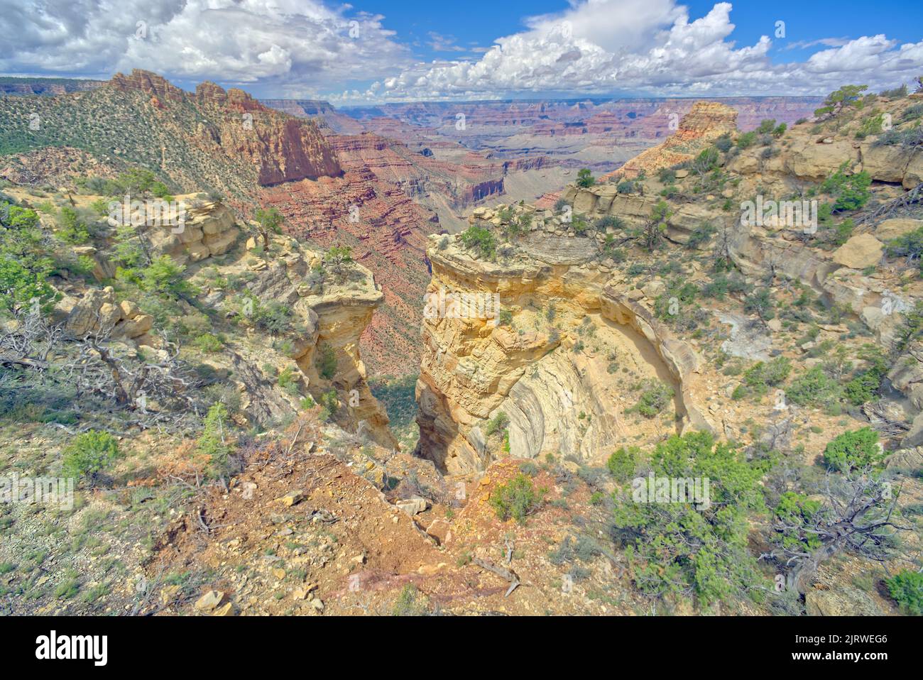 A sinkhole along Coronado Ridge at Grand Canyon Arizona that has become a dry waterfall since it has eroded to the point of opening up the edge of the Stock Photo