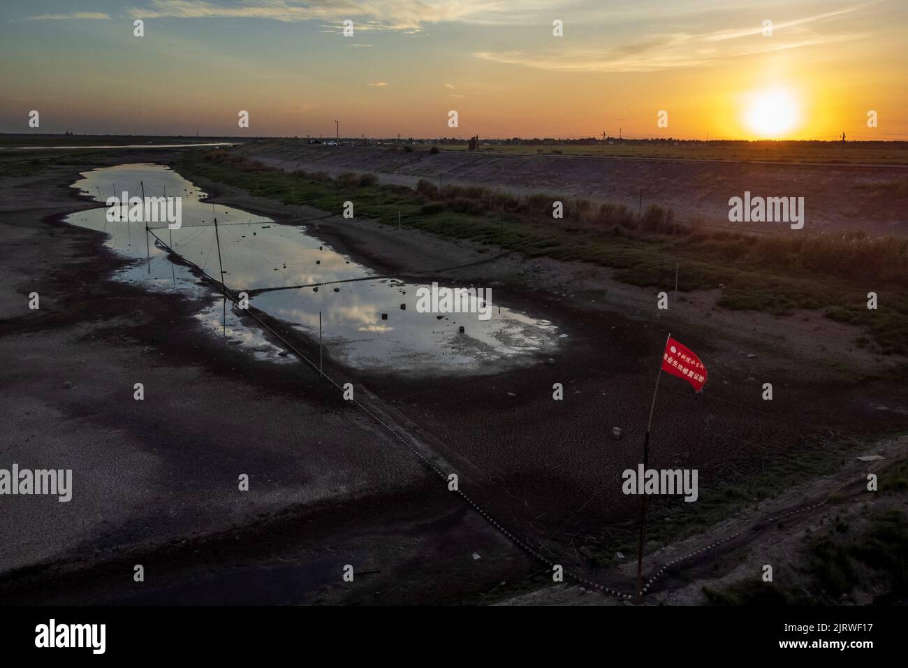 An aerial view shows a dried up fish habitat experimentation farm at Poyang Lake that stands at record-low water levels as the region experiences a drought, outside Nanchang, Jiangxi province, China, August 26, 2022.  REUTERS/Thomas Peter Stock Photo