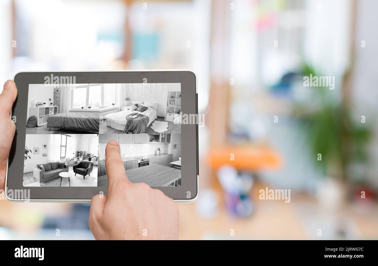 hands with video control on tablet pc at home Stock Photo