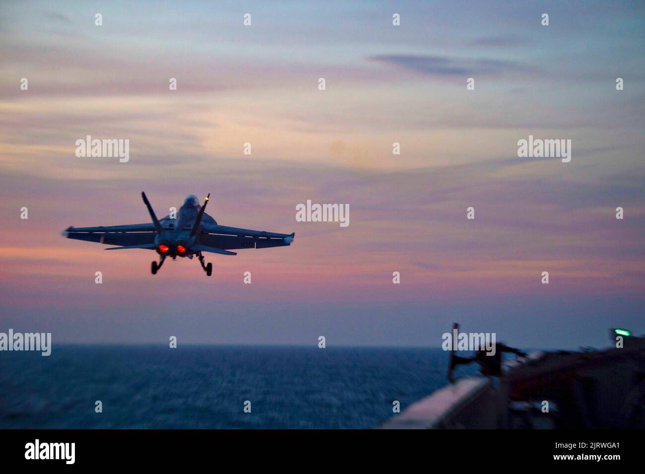 Palma, Spain. 24th Aug, 2022. A U.S. Navy F/A-18F Super Hornet fighter aircraft, attached to the Red Rippers of Strike Fighter Squadron 11 launches at sunset from the flight deck of the Nimitz-class aircraft carrier USS Harry S. Truman during NATO operations, August 24, 2022 off the coast of Mallorca, Spain. Credit: MC3 Jack Hoppe/U.S. Navy/Alamy Live News Stock Photo
