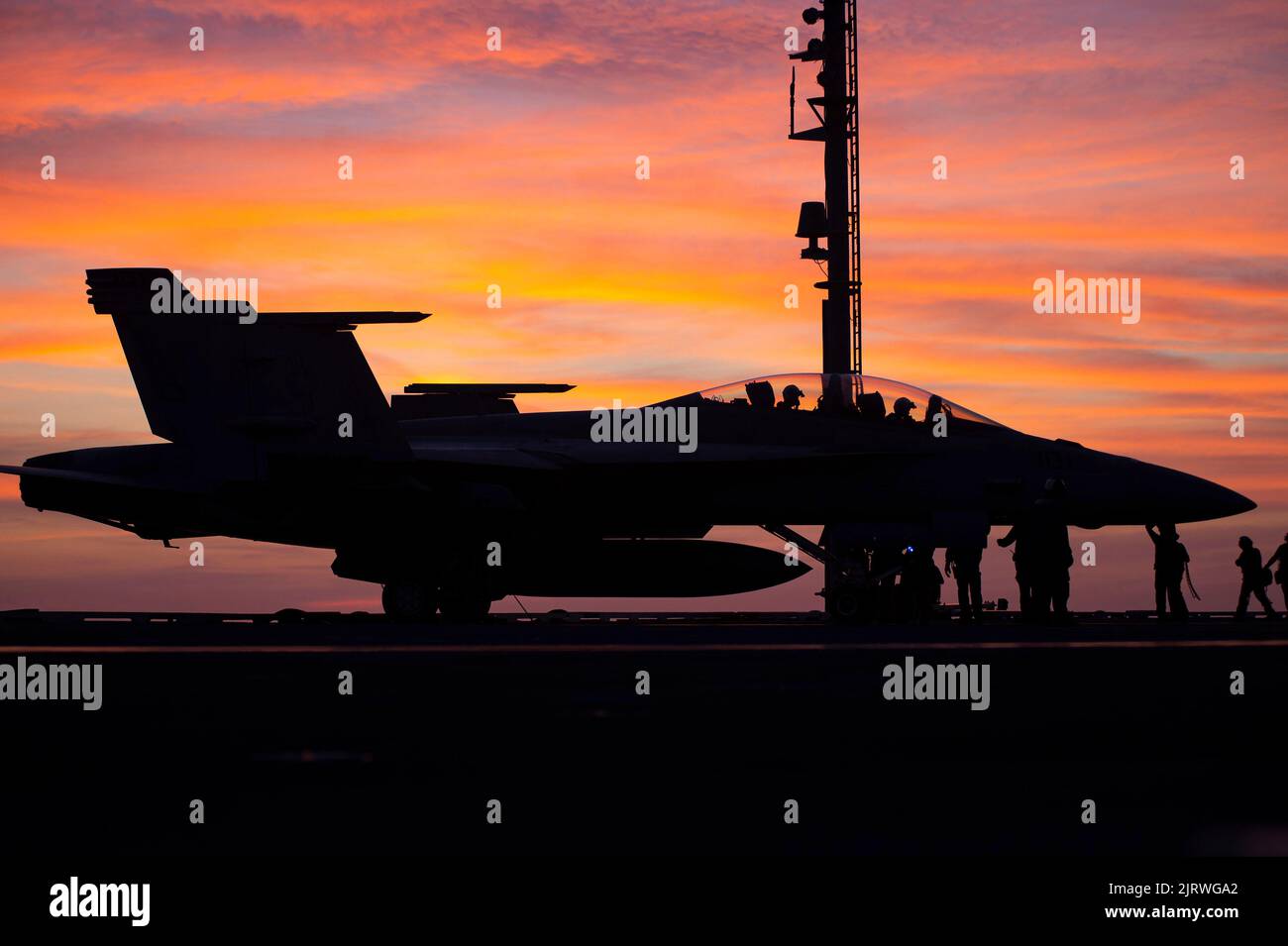 Palma, Spain. 24th Aug, 2022. A U.S. Navy F/A-18F Super Hornet fighter aircraft, attached to the Red Rippers of Strike Fighter Squadron 11 prepares to take off at sunset from the flight deck of the Nimitz-class aircraft carrier USS Harry S. Truman during NATO operations, August 24, 2022 off the coast of Mallorca, Spain. Credit: MC3 Hunter Day/U.S. Navy/Alamy Live News Stock Photo