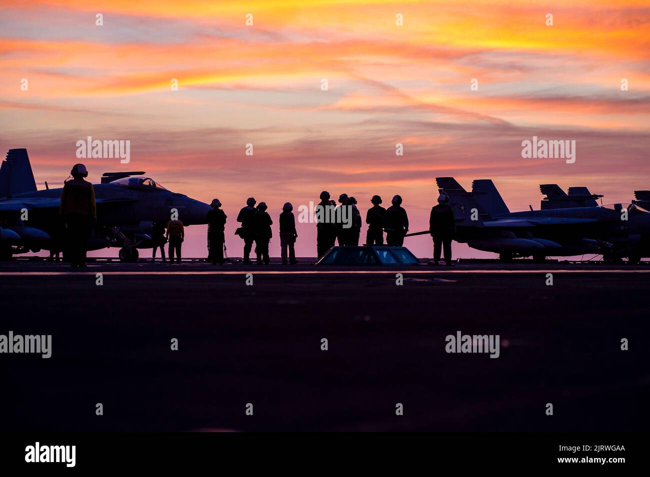 Palma, Spain. 24th Aug, 2022. U.S. Navy sailors prepare F/A-18F Super Hornet fighter aircraft, attached to the Red Rippers of Strike Fighter Squadron 11 for sunset operations off the flight deck of the Nimitz-class aircraft carrier USS Harry S. Truman during NATO operations, August 24, 2022 off the coast of Mallorca, Spain. Credit: MC3 Hunter Day/U.S. Navy/Alamy Live News Stock Photo