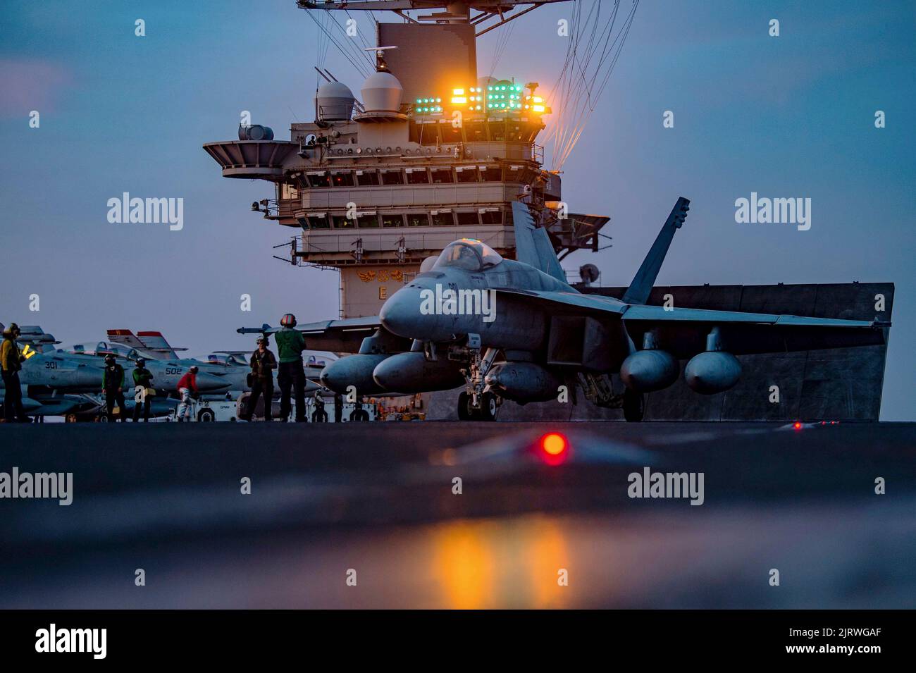 Palma, Spain. 24th Aug, 2022. A U.S. Navy F/A-18E Super Hornet fighter aircraft, attached to the Fighting Checkmates of Strike Fighter Squadron 211 prepares to launch during twilight operations from the flight deck of the Nimitz-class aircraft carrier USS Harry S. Truman, August 24, 2022 off the coast of Mallorca, Spain. Credit: MC3 Jack Hoppe/U.S. Navy/Alamy Live News Stock Photo