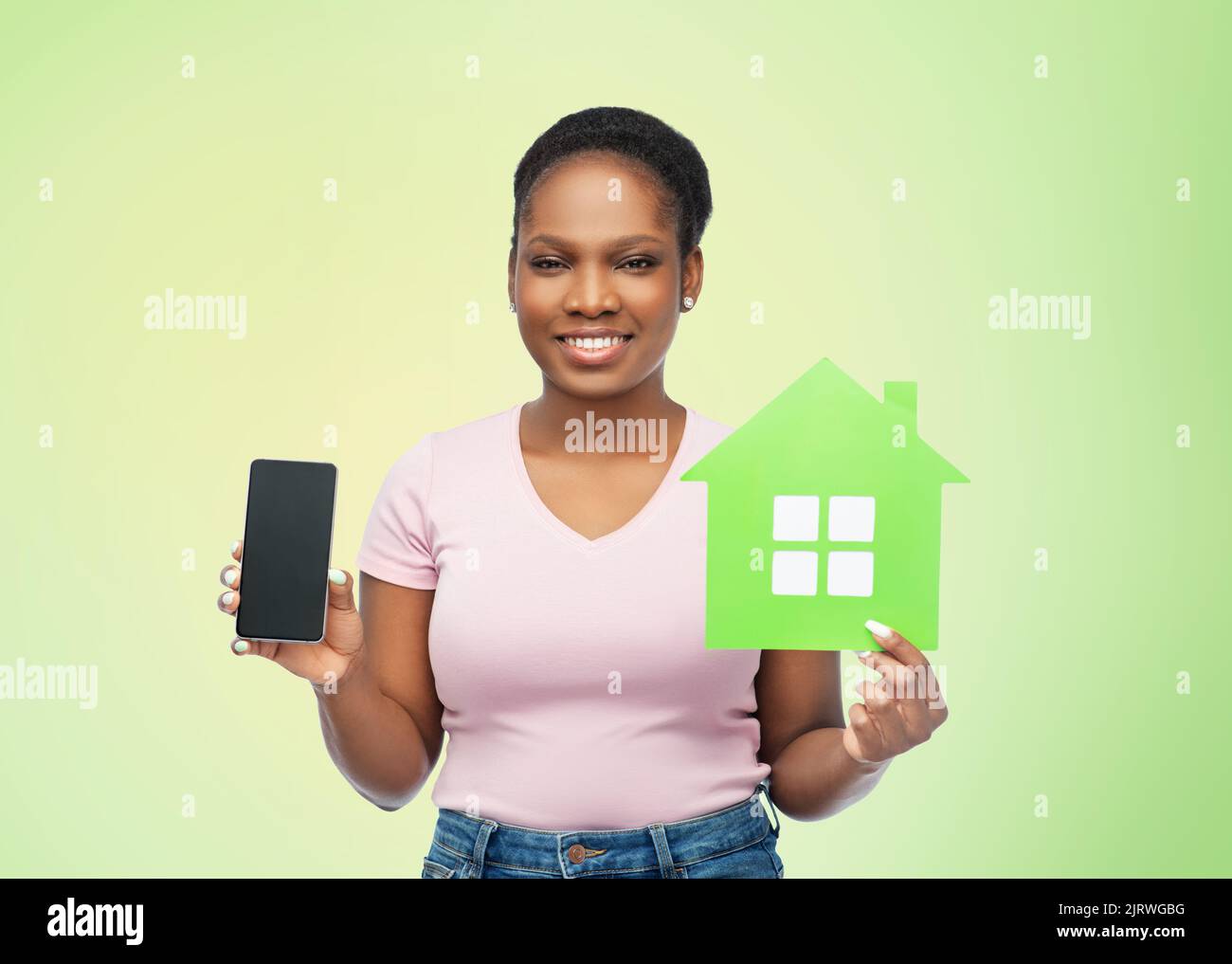 Happy african woman in green hi-res stock photography and images - Alamy