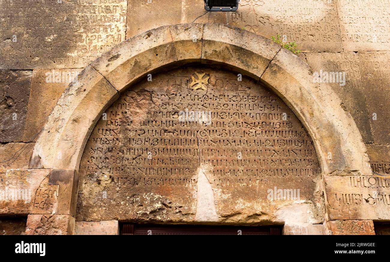 Text in ancient Armenian above the entrance to the monastery Stock