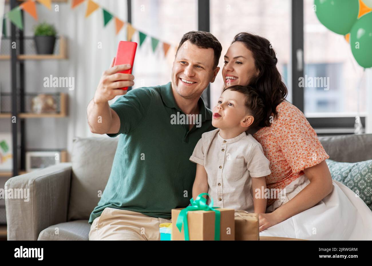 happy family taking selfie on birthday at home Stock Photo - Alamy