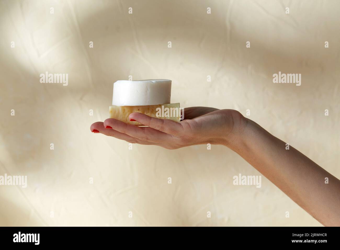 hand holding bar of craft soap on beige background Stock Photo Alamy