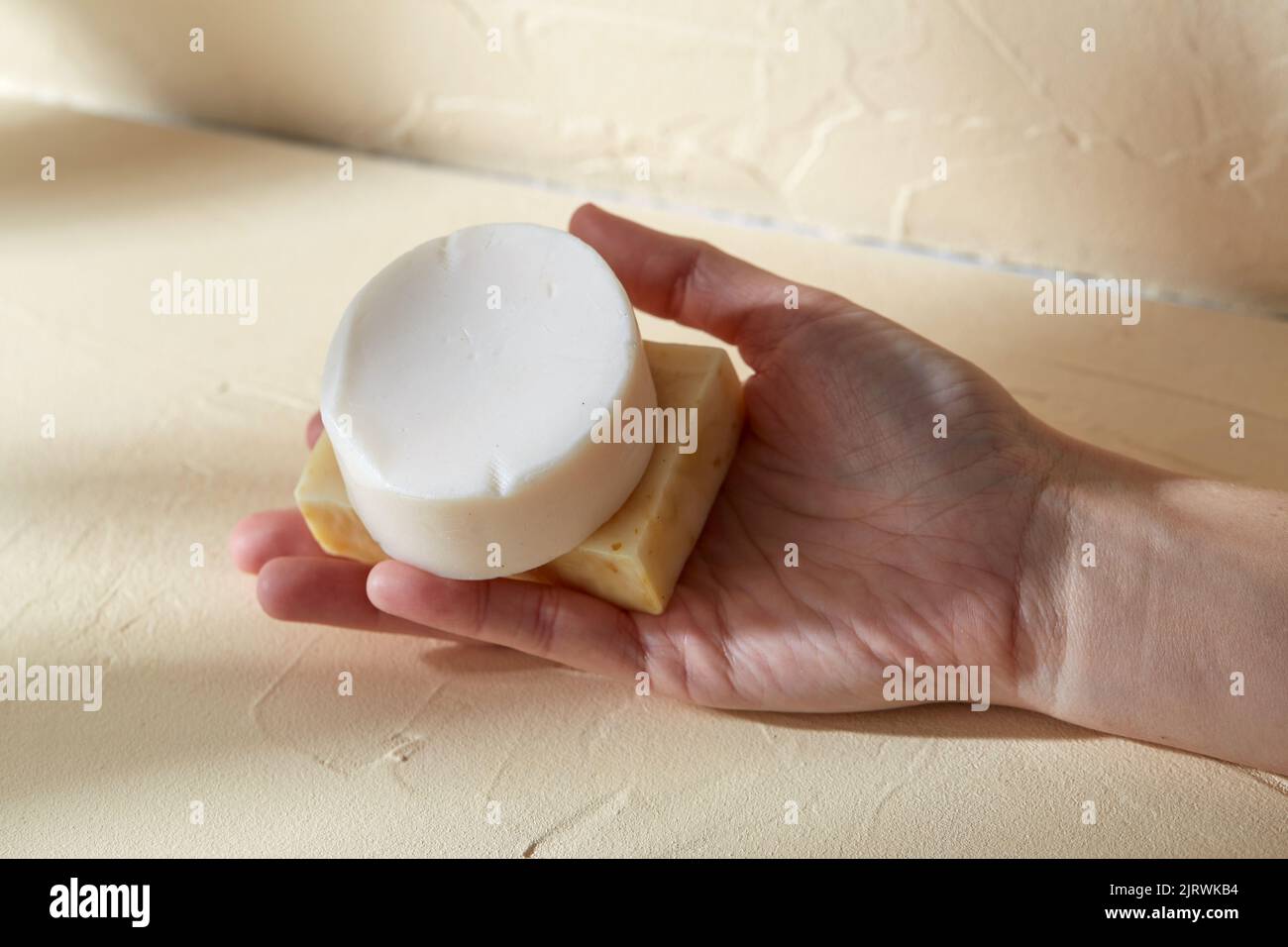 hand holding bar of craft soap on beige background Stock Photo Alamy