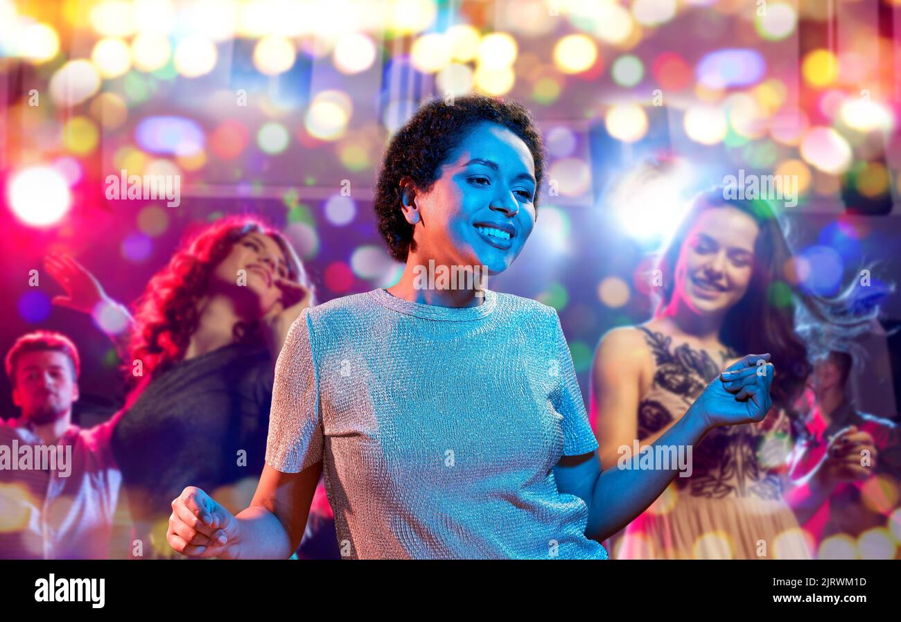 african american woman dancing at nightclub Stock Photo