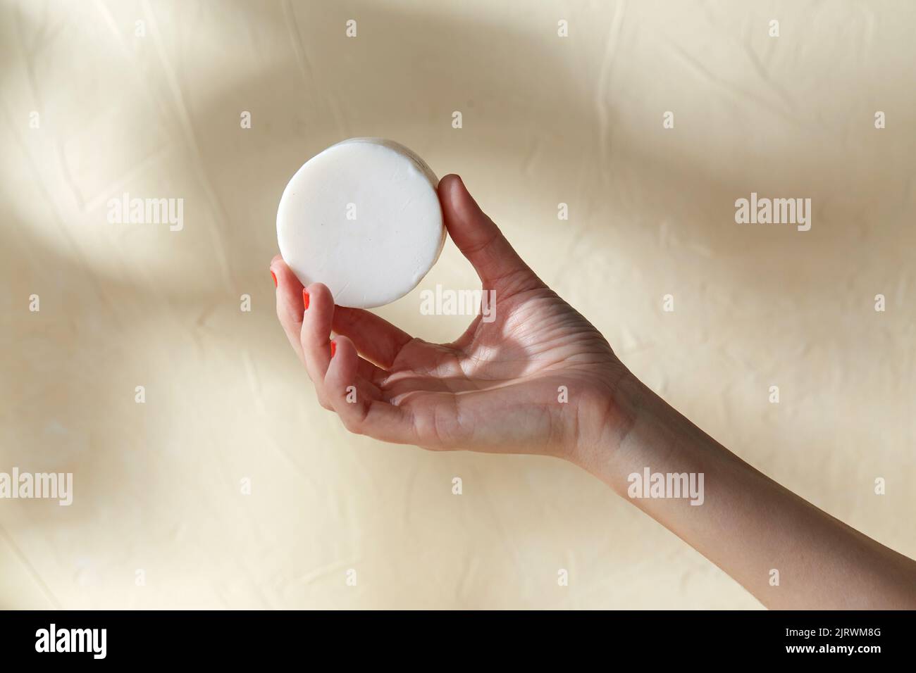 hand holding bar of craft soap on beige background Stock Photo Alamy