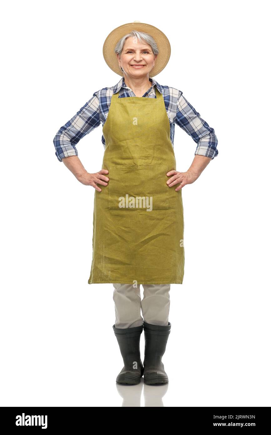 smiling senior woman in garden apron and straw hat Stock Photo