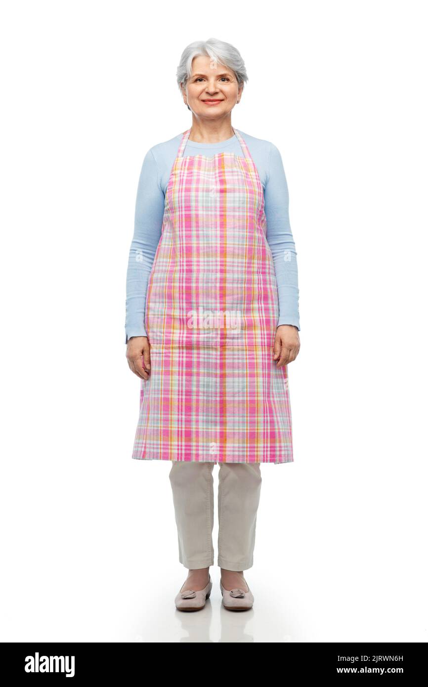 portrait of smiling senior woman in apron Stock Photo - Alamy