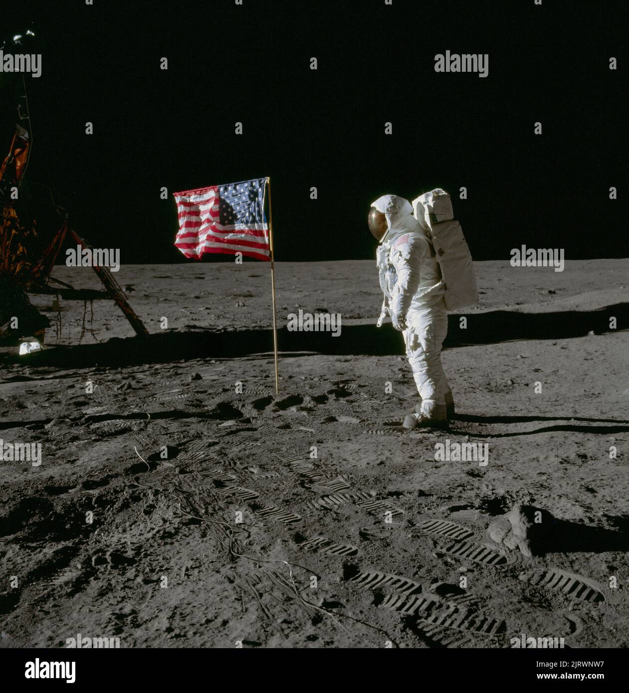 SEA OF TRANQUILITY, THE MOON, EARTH - 20 July 1969 - Astronaut Edwin E Aldrin Jr, lunar module pilot,  on the surface of the Moon with a US flag near Stock Photo