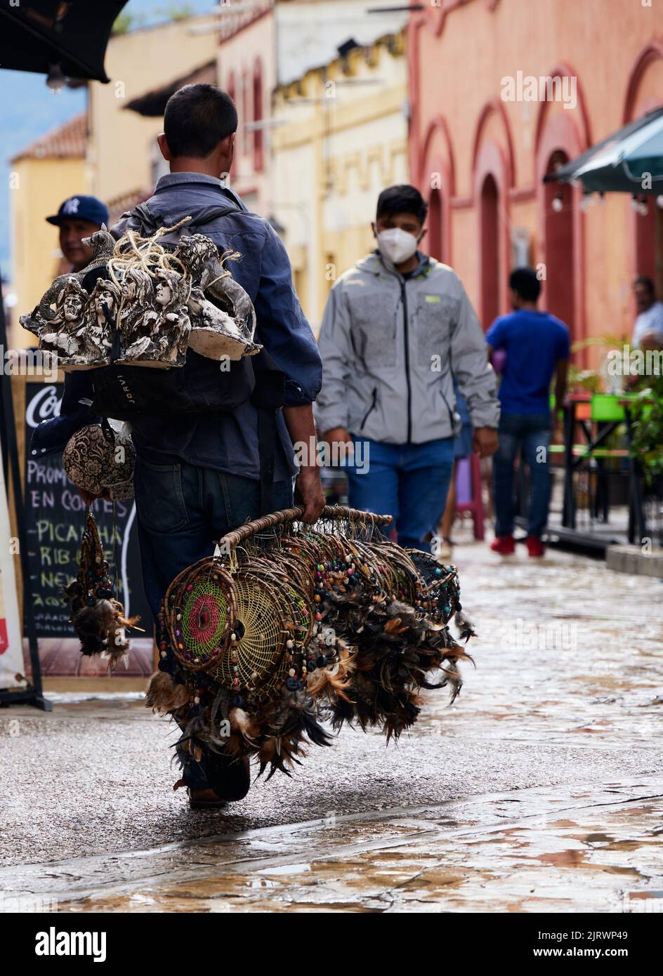 A salesperson selling statues and dreamcatchers in the streets of San