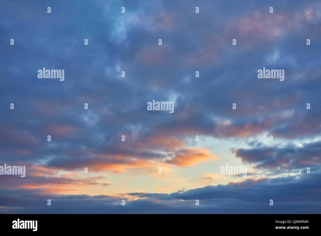 Cloudscape of cumulus sunset clouds with sunlight Stock Photo - Alamy