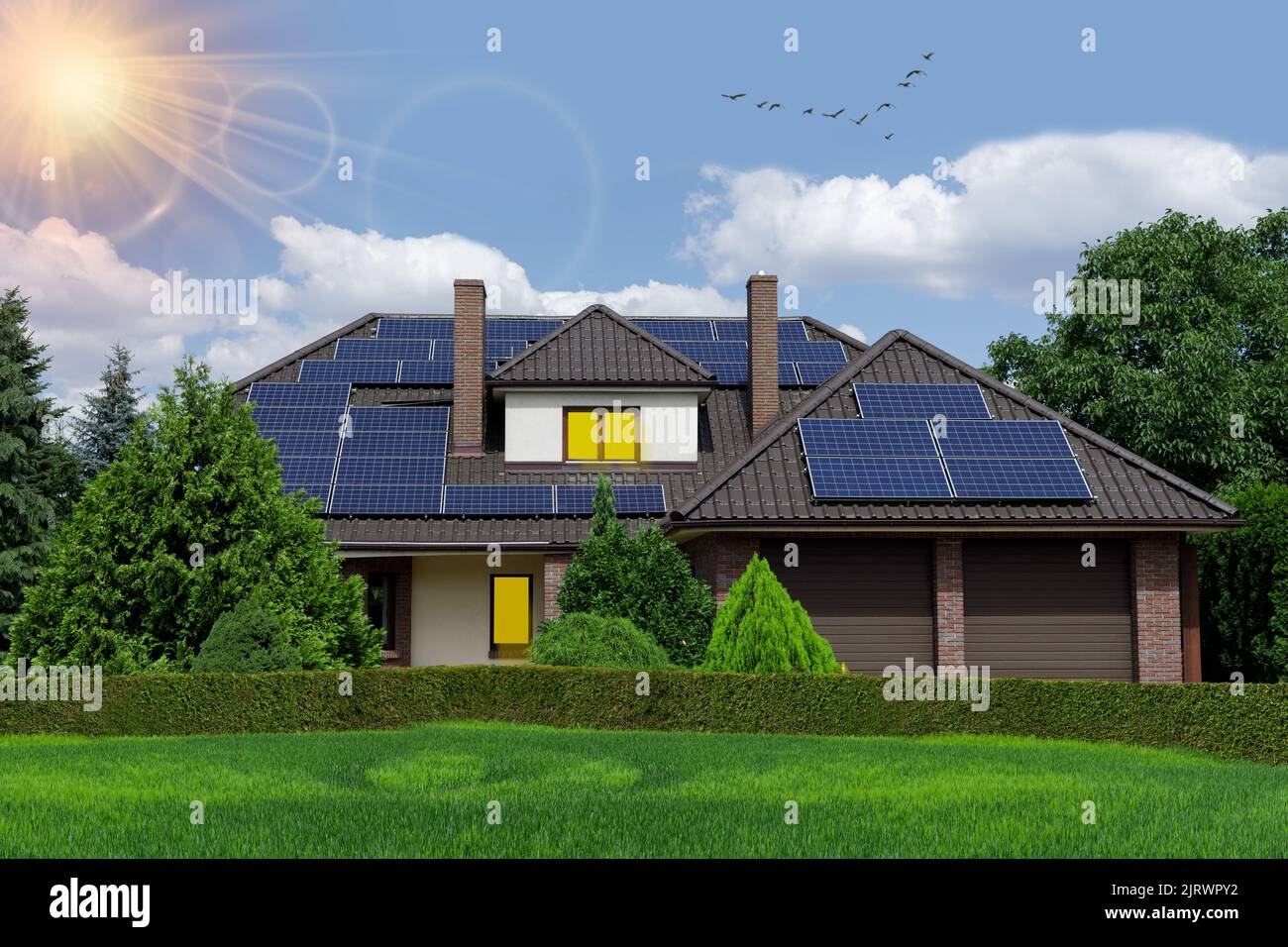 Solar panels on the roof of a beautiful house surrounded by greenery, sunny weather. Photovoltaik conceptual image, Stock Photo