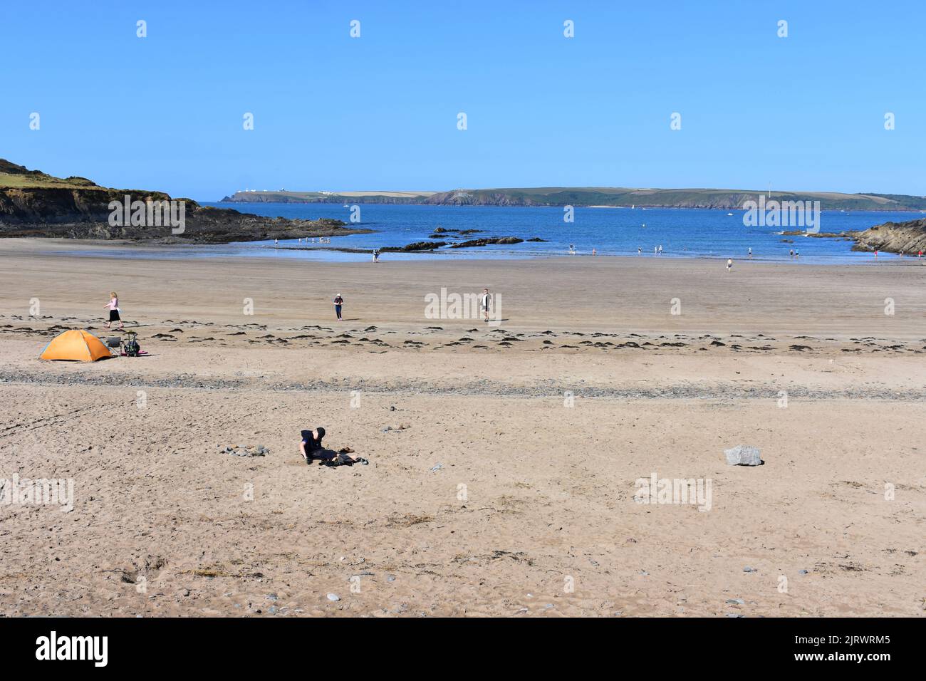 Holidaymakers enjoying West Angle Bay, Pembrokeshire, Wales Stock Photo