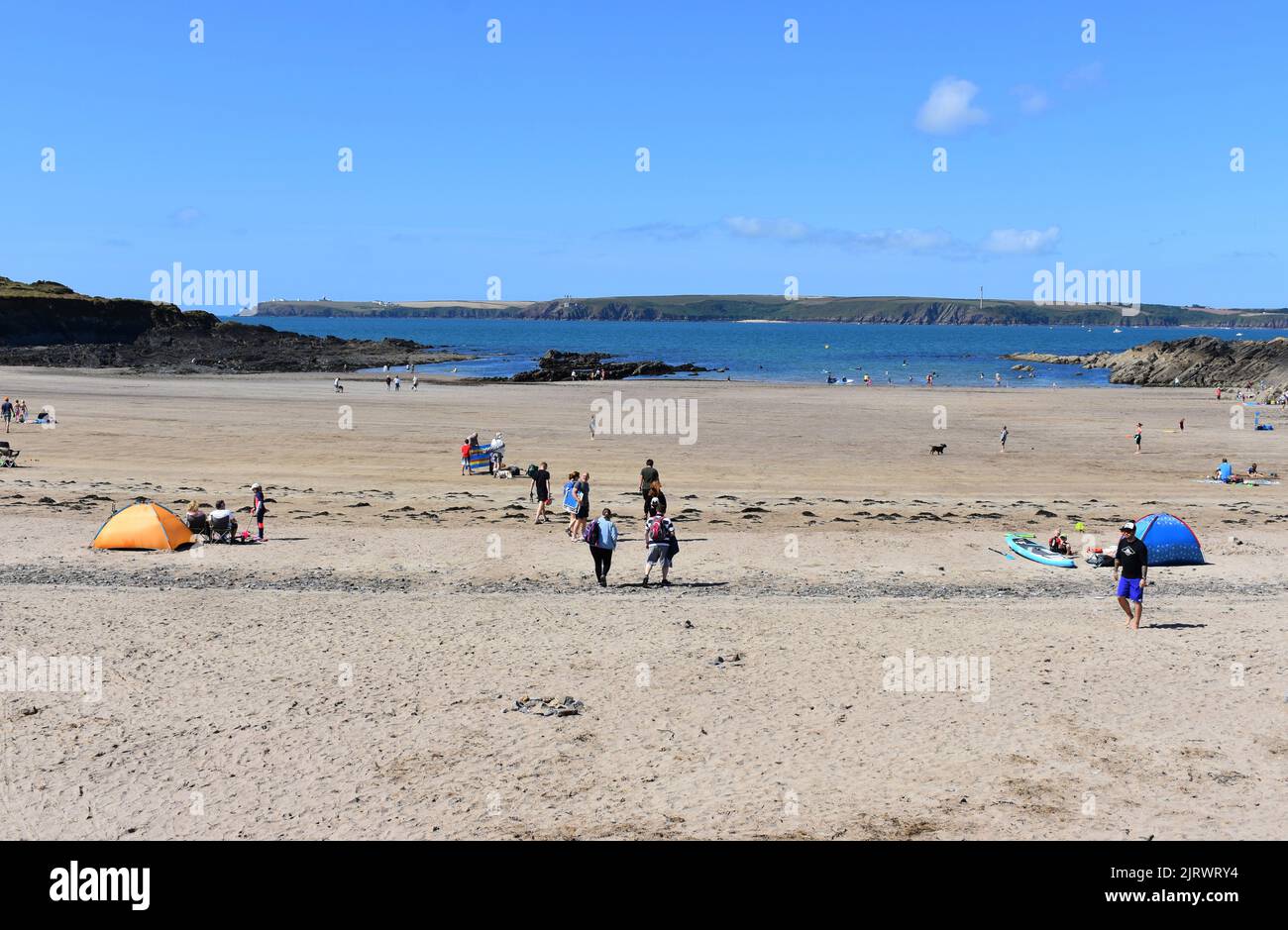 Holidaymakers enjoying West Angle Bay, Pembrokeshire, Wales Stock Photo