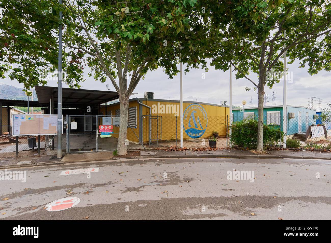 Entrance to children's school barracks modules, located in the park surrounded by trees in