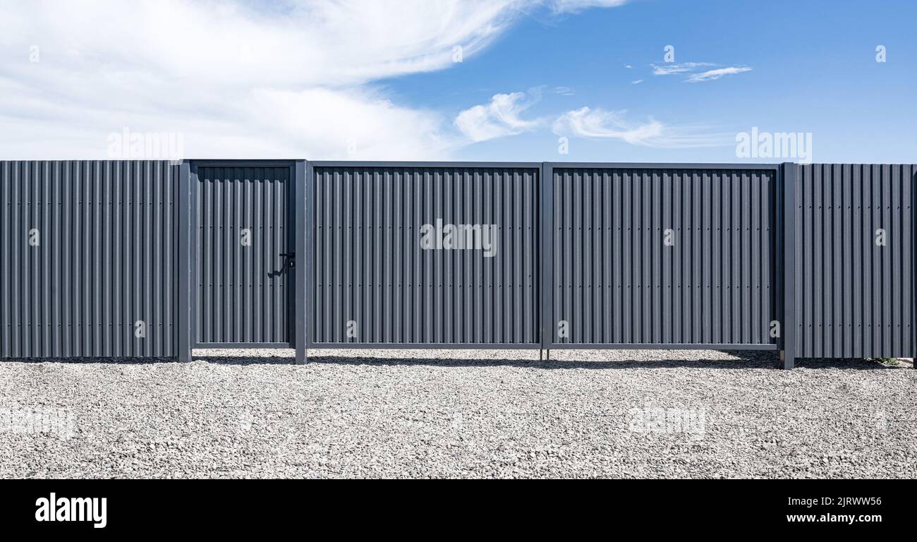 Iron gates from a profiled sheet Stock Photo Alamy