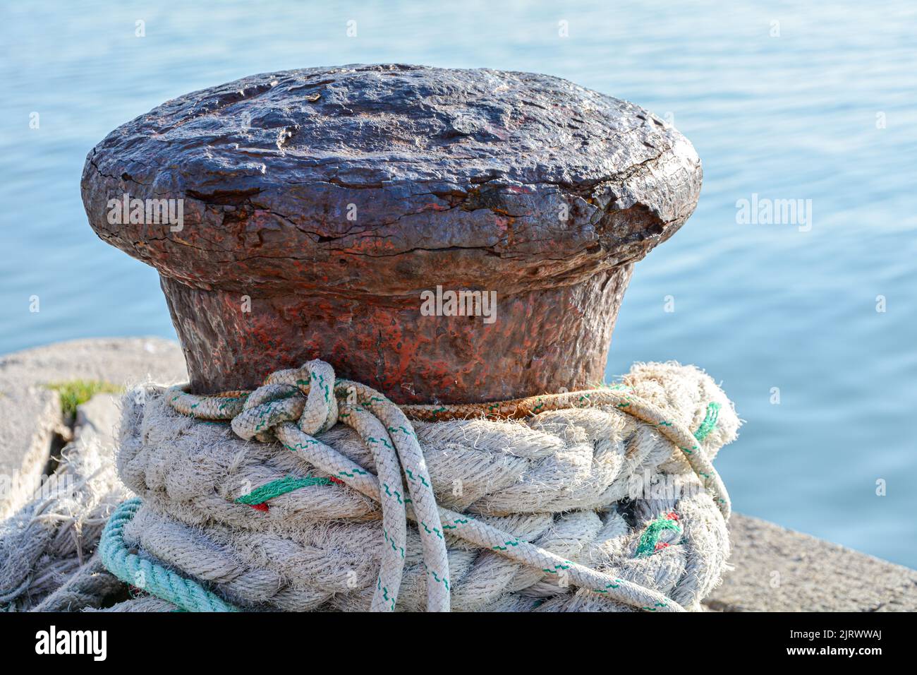 Close up of bollard for rusty mooring rope Stock Photo