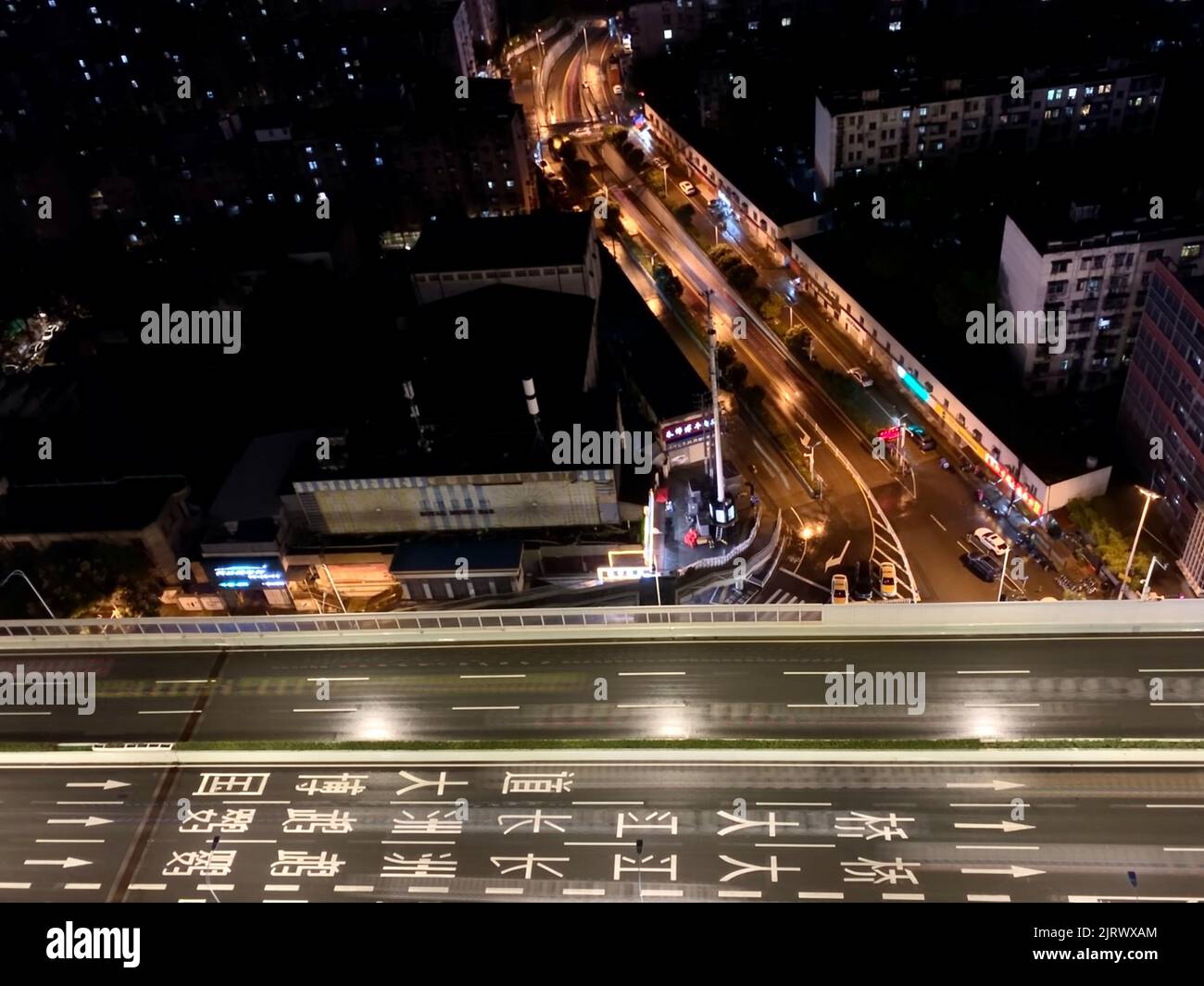 An aerial picture of buildings and roads in Wuhan city during nighttime Stock Photo