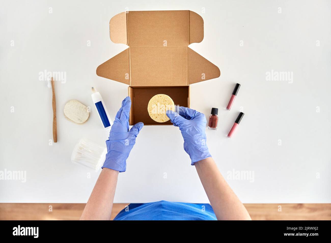 Hands in gloves packing parcel hi-res stock photography and images - Alamy