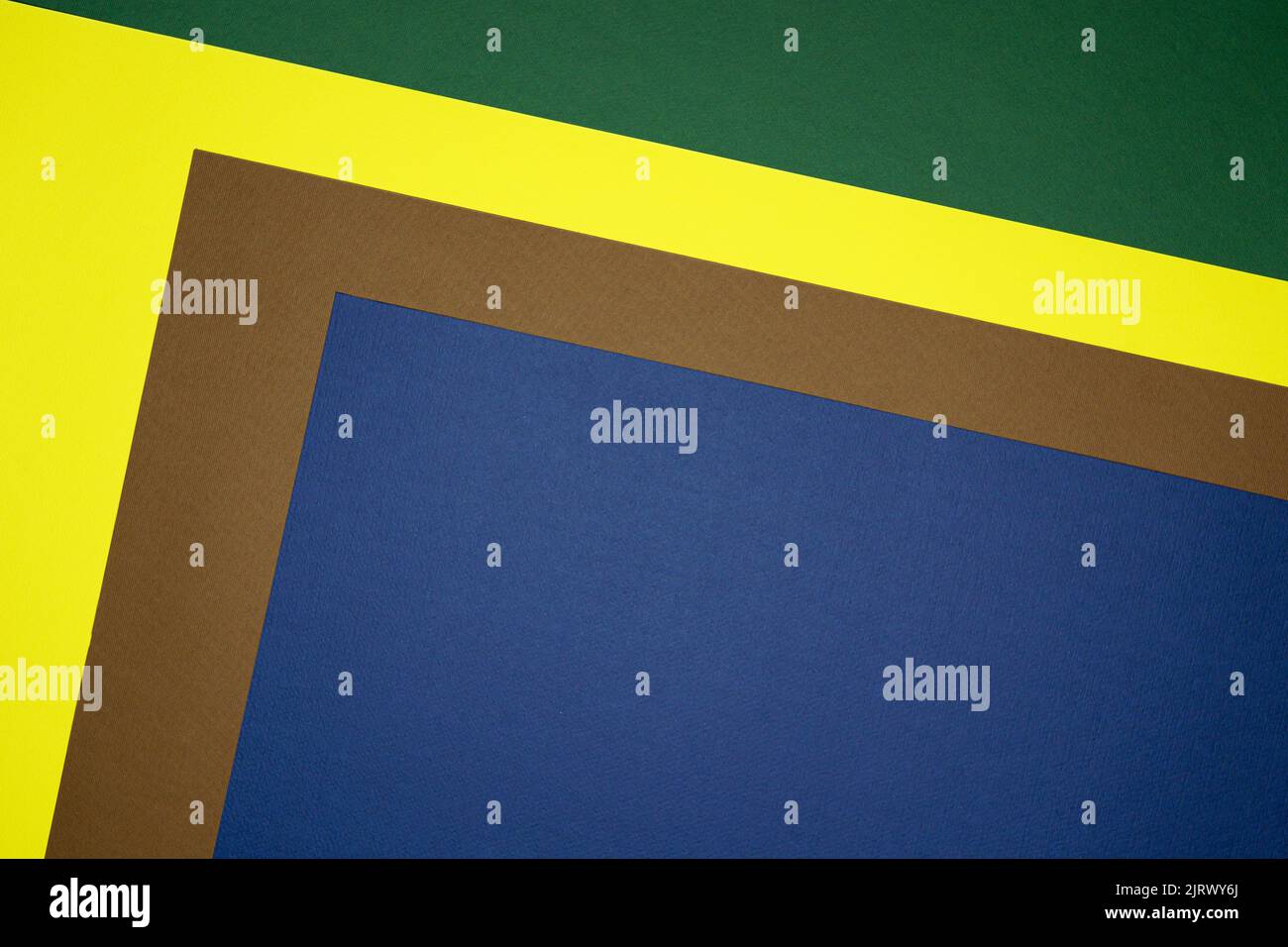 Brown, yellow, green, blue four tone color paper background with ...