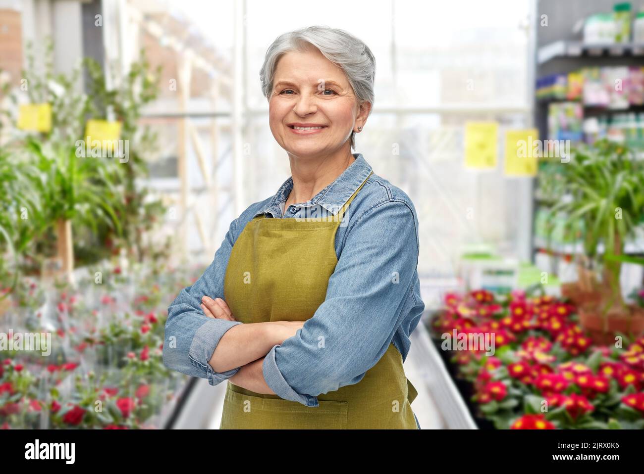 Woman in denim apron arms hi-res stock photography and images - Alamy