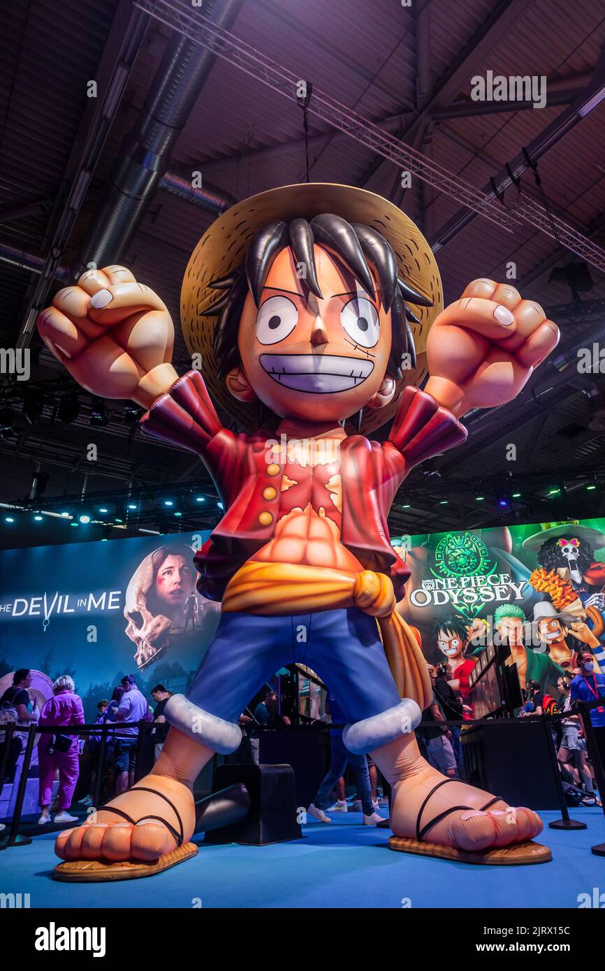 Cologne, Germany. 24th Aug, 2022. Gamescom 2022: Oversized figure of Monkey D. Luffy, fictional character and main protagonist of the 'One Piece' manga series, at the booth of Bandai Namco Entertainment, presenting role-playing video game One Piece Odyssey, developed by ILCA, published by Bandai Namco Entertainment. Gamescom is the world's largest trade fair for computer and video games, at Koelnmesse in Cologne, Germany. Photocredit: Christian Lademann / lademann.media Stock Photo