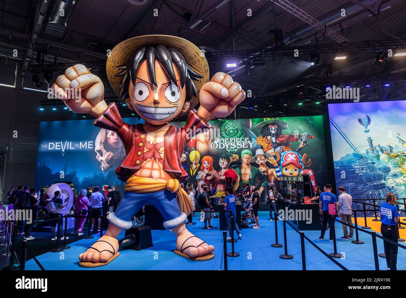 Cologne, Germany. 24th Aug, 2022. Gamescom 2022: Oversized figure of Monkey D. Luffy, fictional character and main protagonist of the 'One Piece' manga series, at the booth of Bandai Namco Entertainment, presenting role-playing video game One Piece Odyssey, developed by ILCA, published by Bandai Namco Entertainment. Gamescom is the world's largest trade fair for computer and video games, at Koelnmesse in Cologne, Germany. Photocredit: Christian Lademann / lademann.media Stock Photo