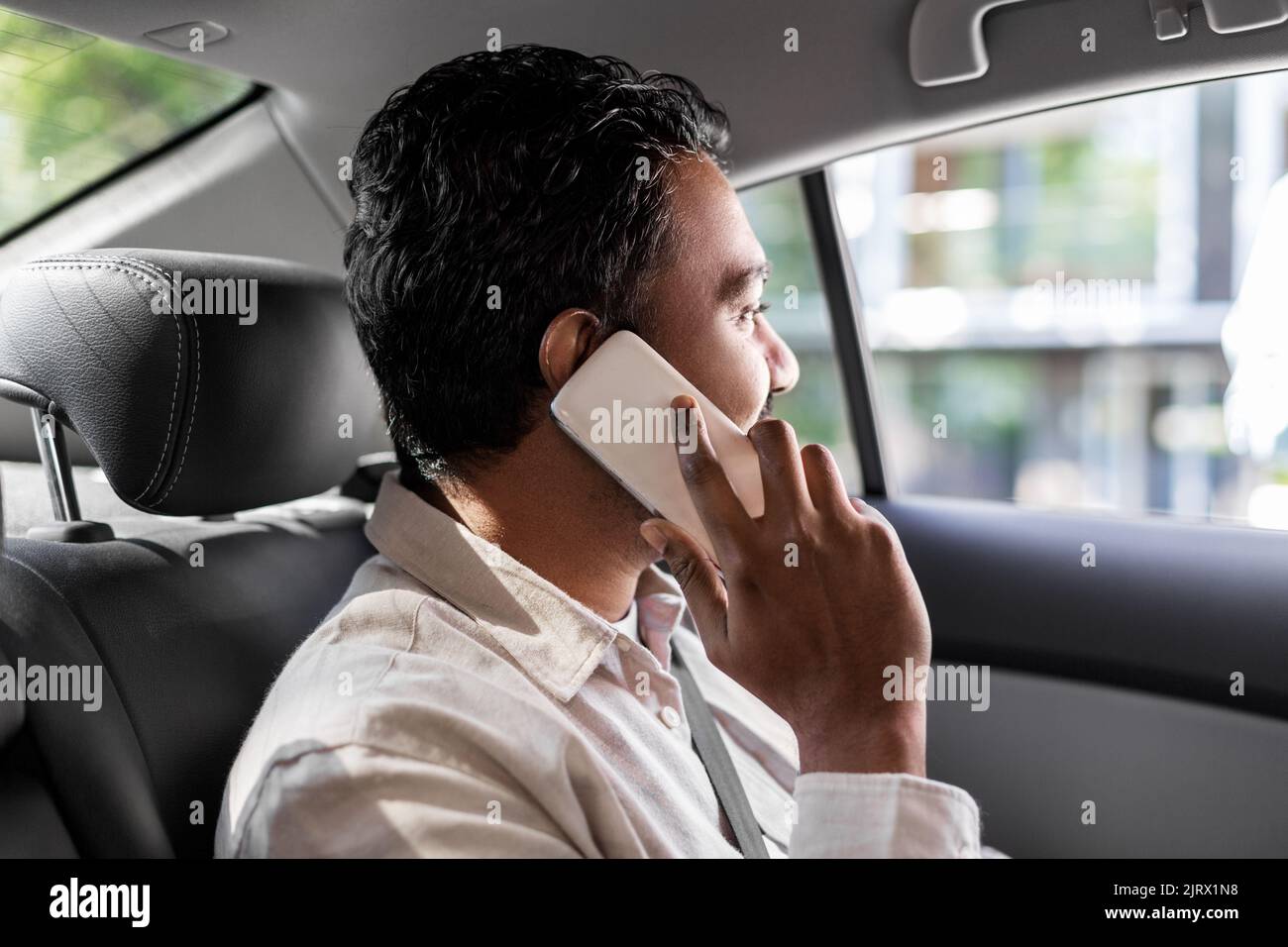 male passenger calling on smartphone in taxi car Stock Photo Alamy