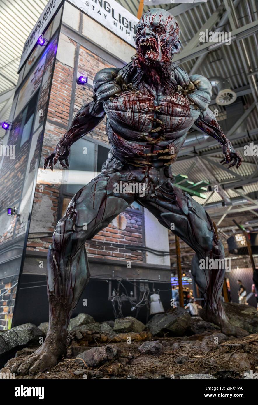 Cologne, Germany. 24th Aug, 2022. Gamescom 2022: Zombie figure in front of booth for survival horror game Dying Light 2 Stay Human, developed and published by Techland. Gamescom is the world's largest trade fair for computer and video games, at Koelnmesse in Cologne, Germany. Photocredit: Christian Lademann / lademann.media Stock Photo