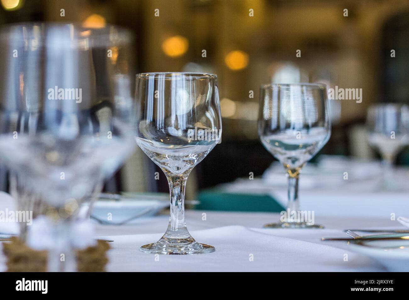 Projeto Rio VintageGlass bowls on a table with white tablecloth and cutlery on the table in Santa Catarina brazil. Stock Photo