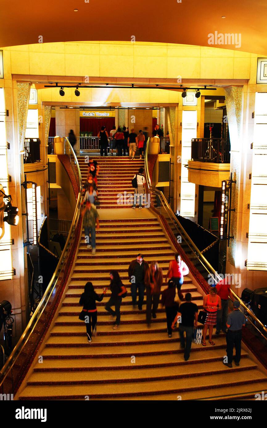 Visitors walk up the stairs of the lobby of the  Dolby Theater, in Hollywood, to get a feel of the place where the Oscars are presented Stock Photo