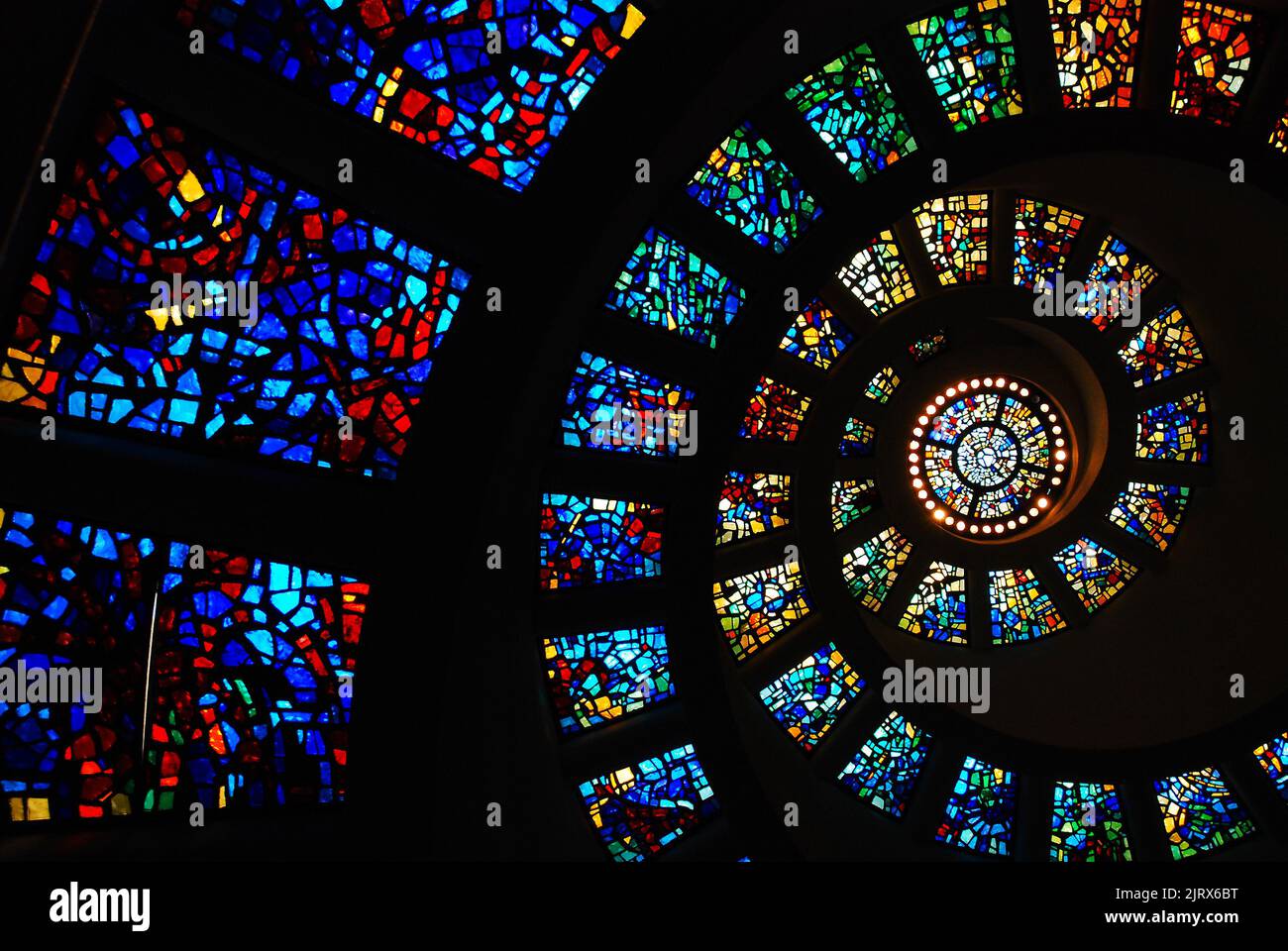 The Circular and spiraling Stained Glass window on the ceiling of the Thanks Giving Chapel, in Dallas, represents the Fibonacci sequence Stock Photo