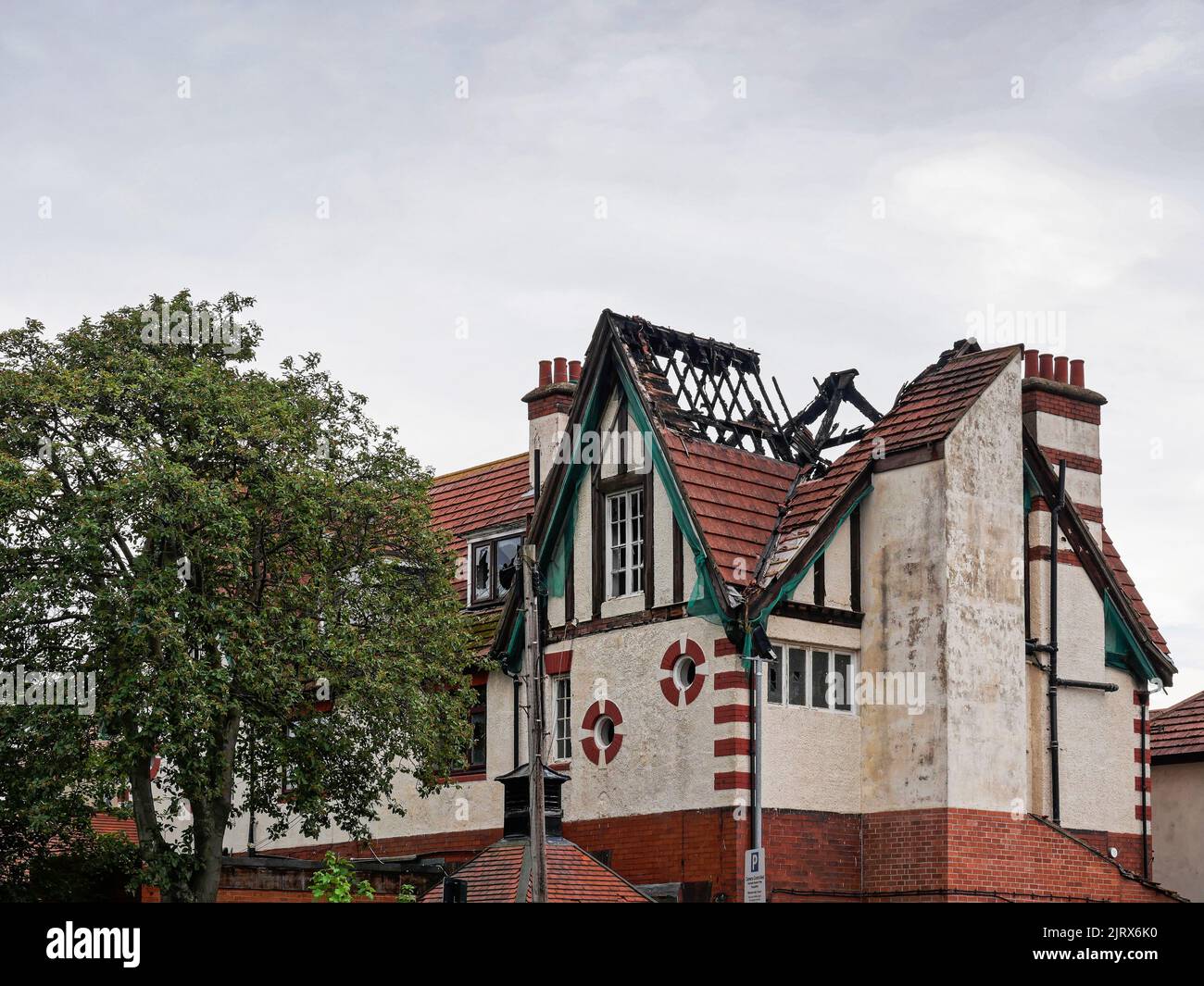 Building with damaged windows and roof, Gosforth, UK Stock Photo
