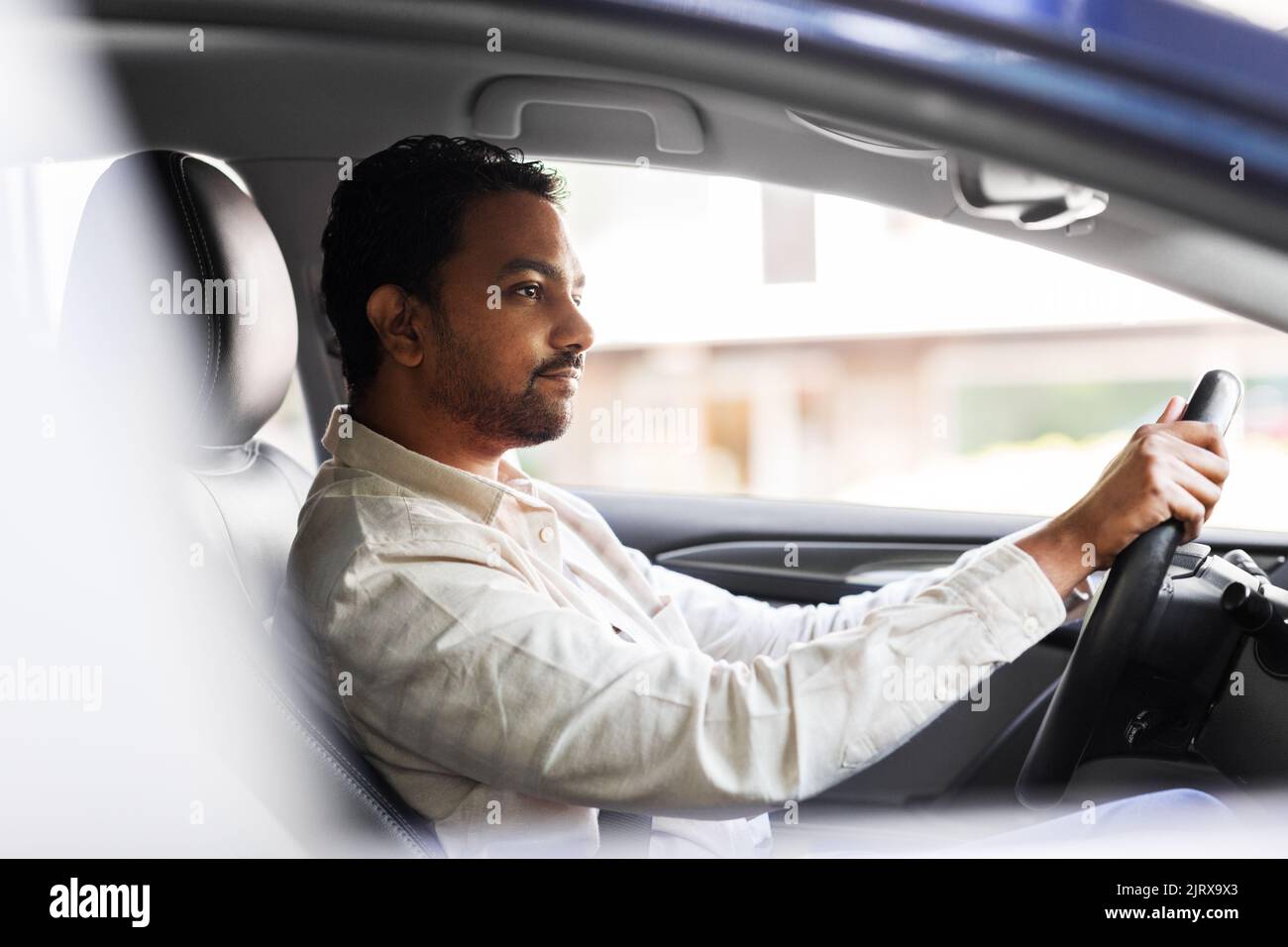 indian man or driver driving car Stock Photo