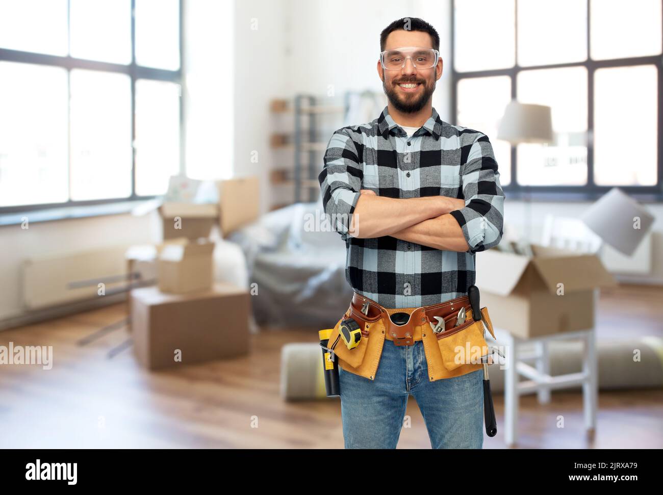 Happy confident young builder hi-res stock photography and images - Alamy