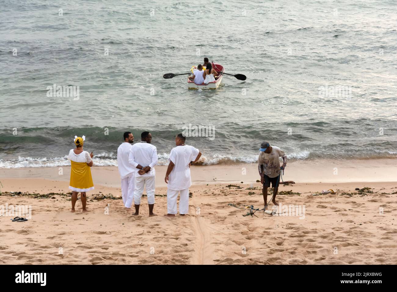 A view of Candomble members delivering gifts to Iemanja, the queen of the sea, at Rio Vermelho beach Stock Photo