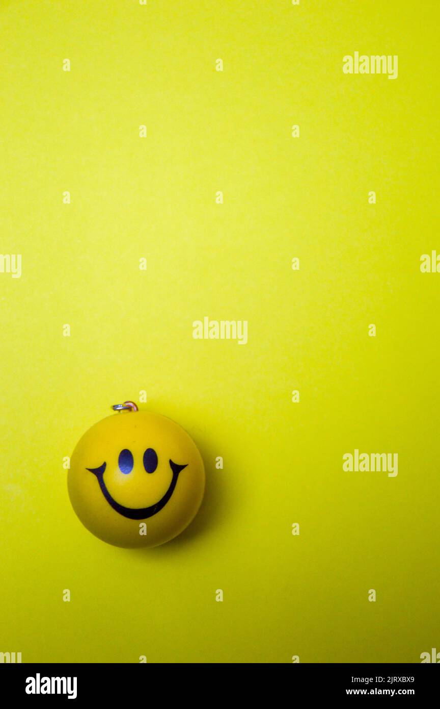 Photo of a yellow smiley face on yellow background Stock Photo