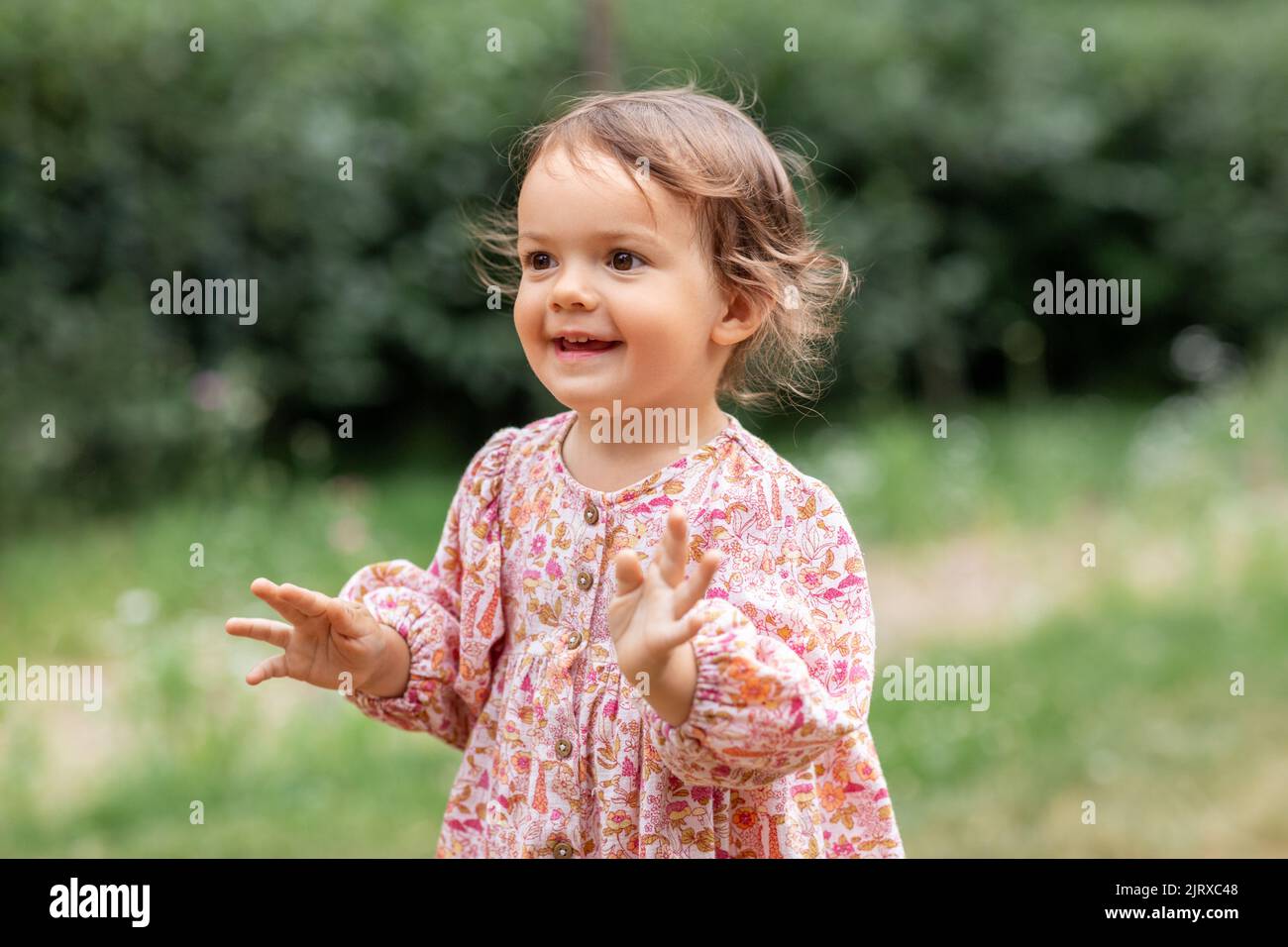happy little baby girl outdoors in summer Stock Photo - Alamy