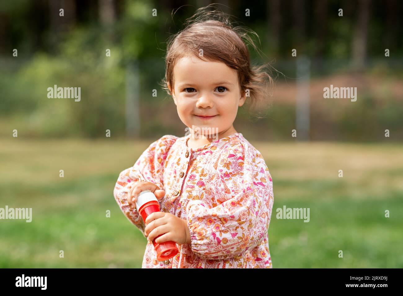 happy baby girl with soap bubble blower in summer Stock Photo - Alamy